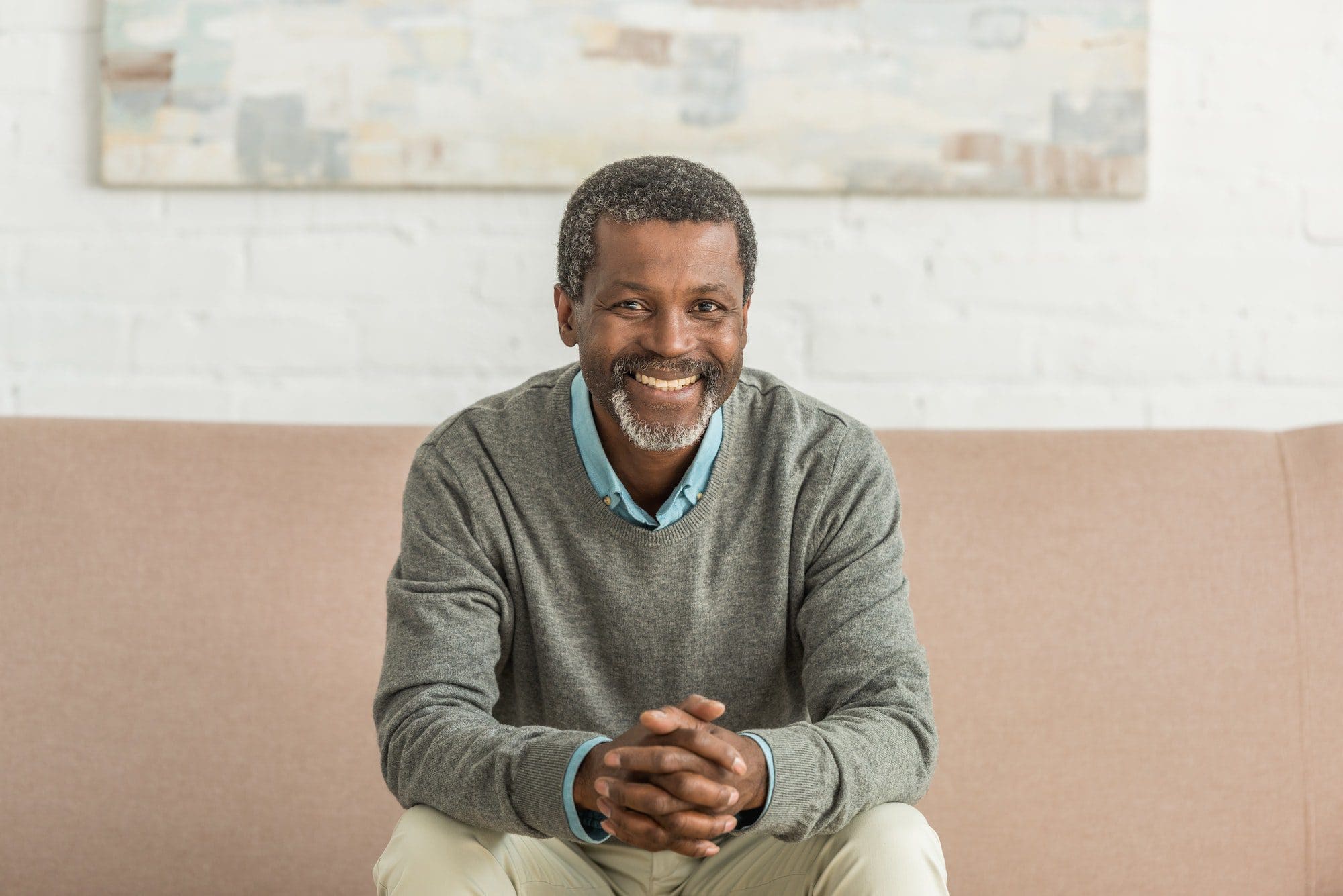 Senior African American exciting about his High Deductible Plan G
