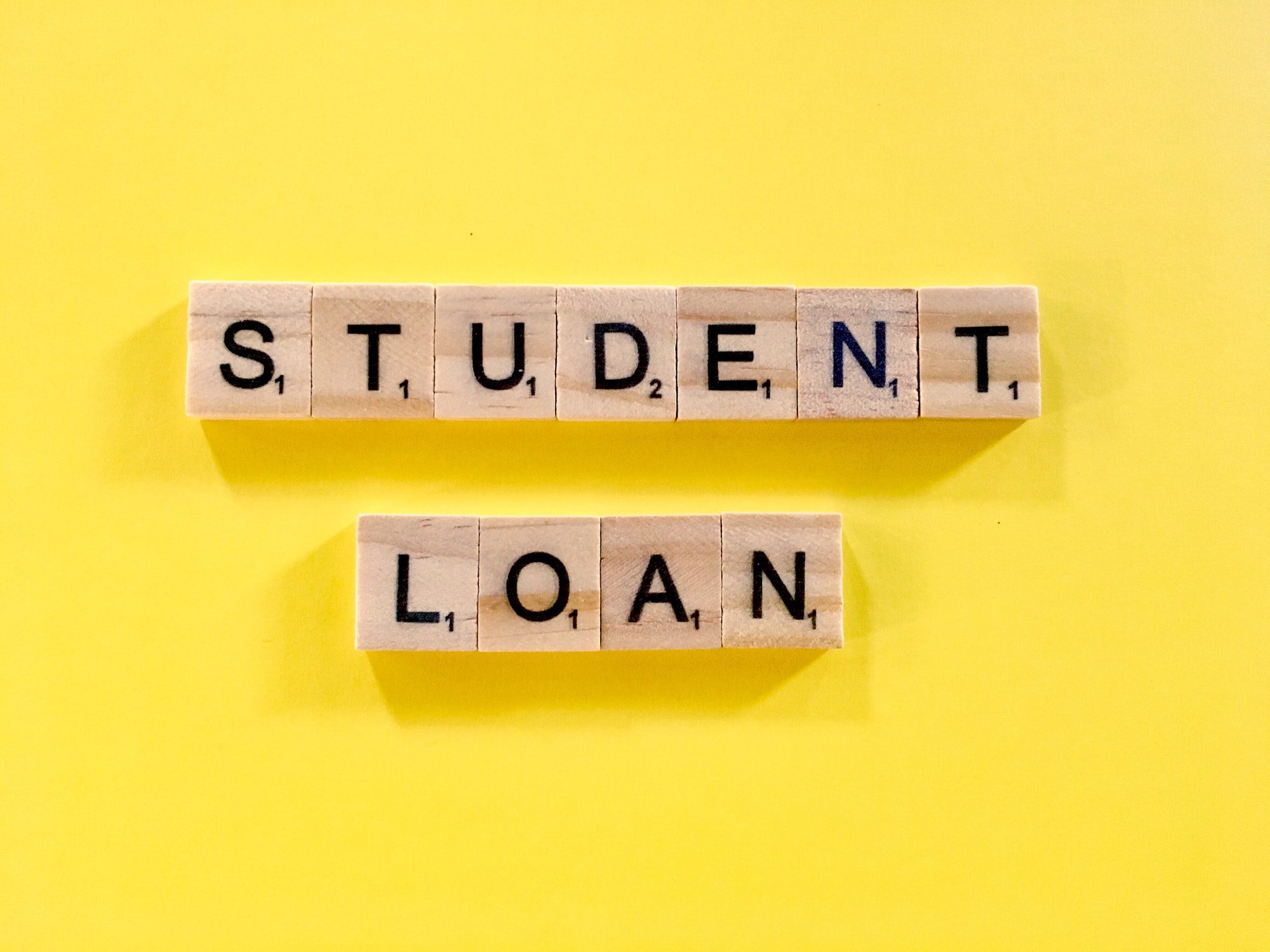 Blocks spelling student loan to show the lighter side of student loan debt for baby boomers.